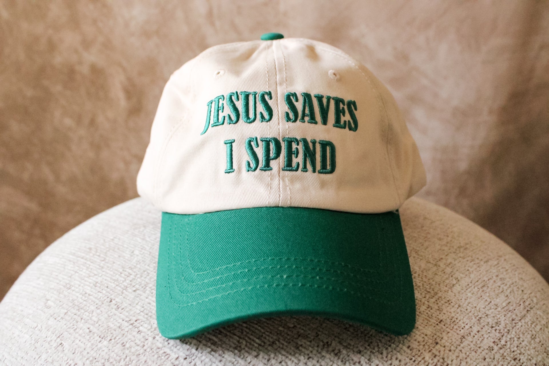 ‘Jesus Saves, I Spend’ Trucker Hat