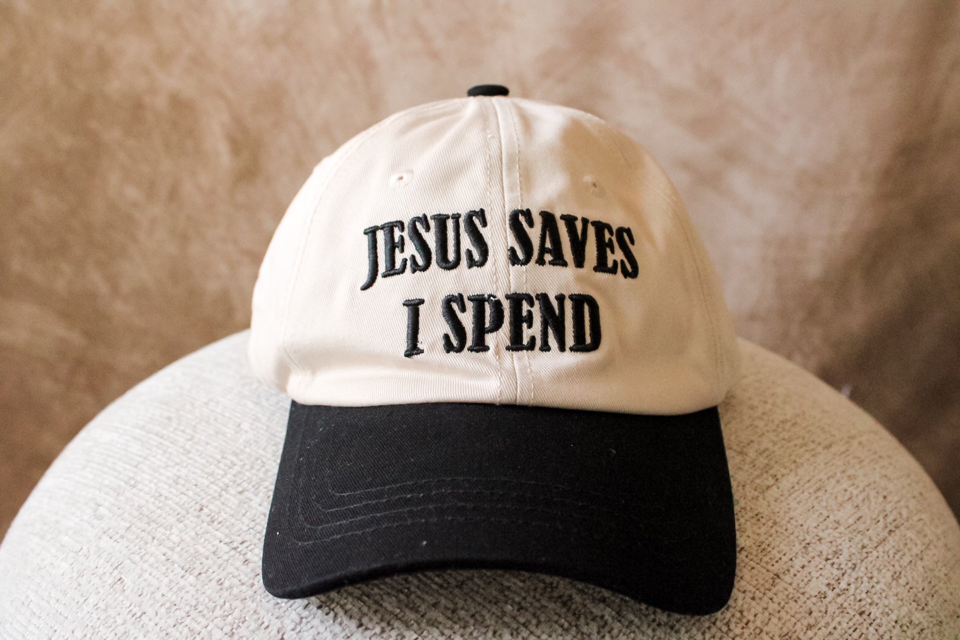‘Jesus Saves, I Spend’ Trucker Hat